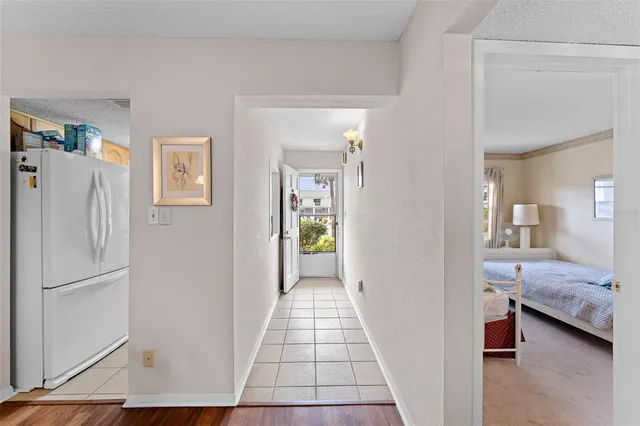 a view of bedroom with bathroom and glass door