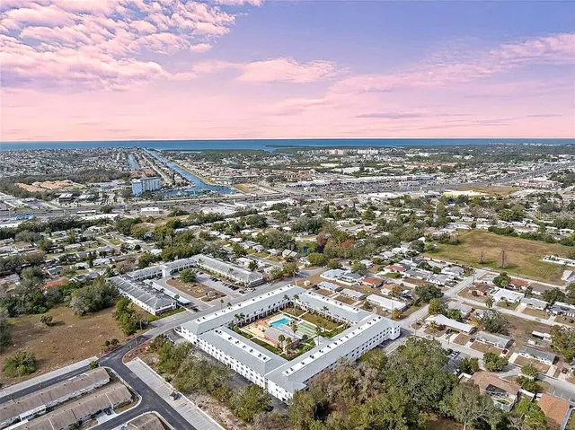 an aerial view of residential houses with city view