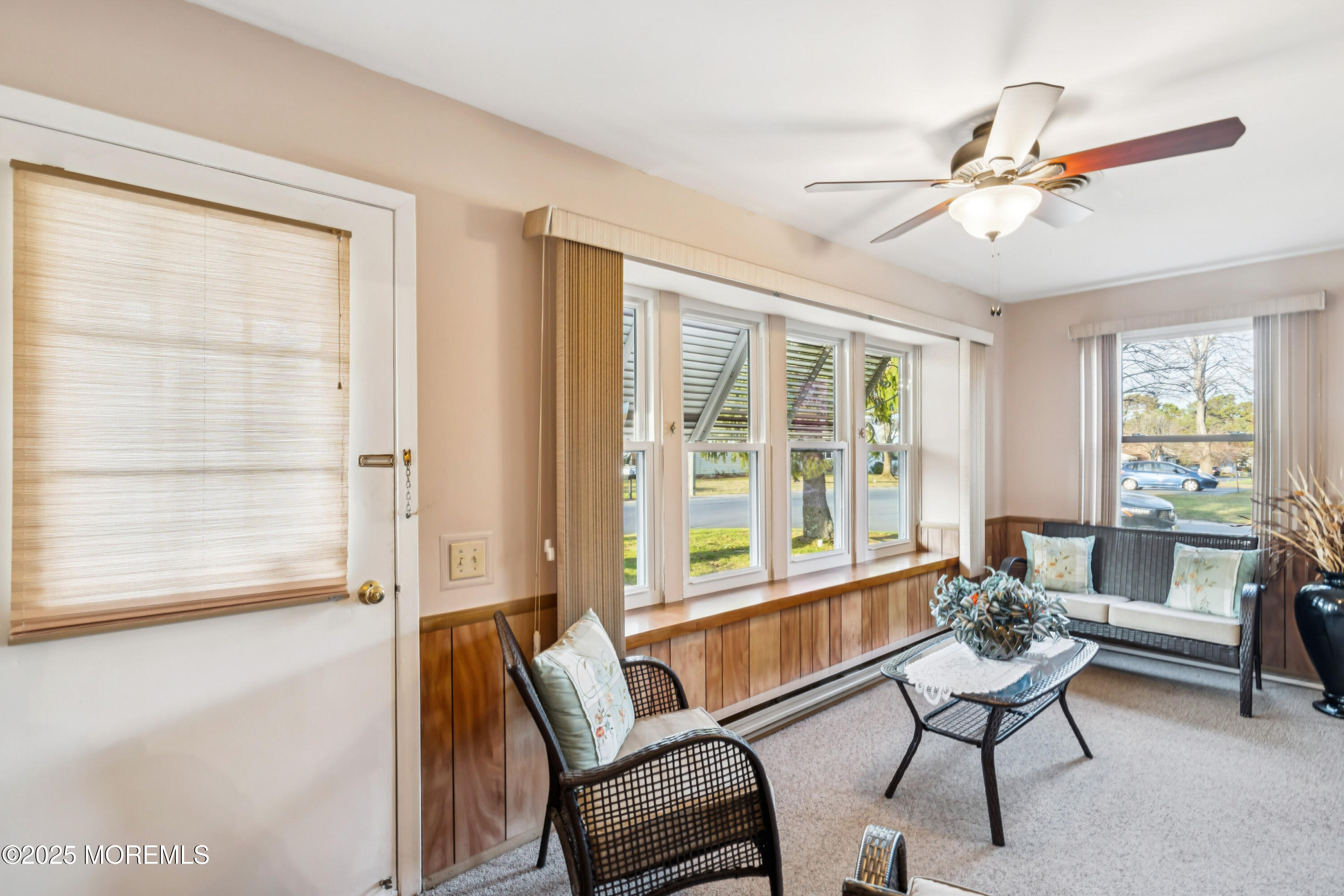 10A Alpine Road, Unit 63 Manchester Township, NJ 08759 - Photo 1 of 25 a living room with furniture and a large window