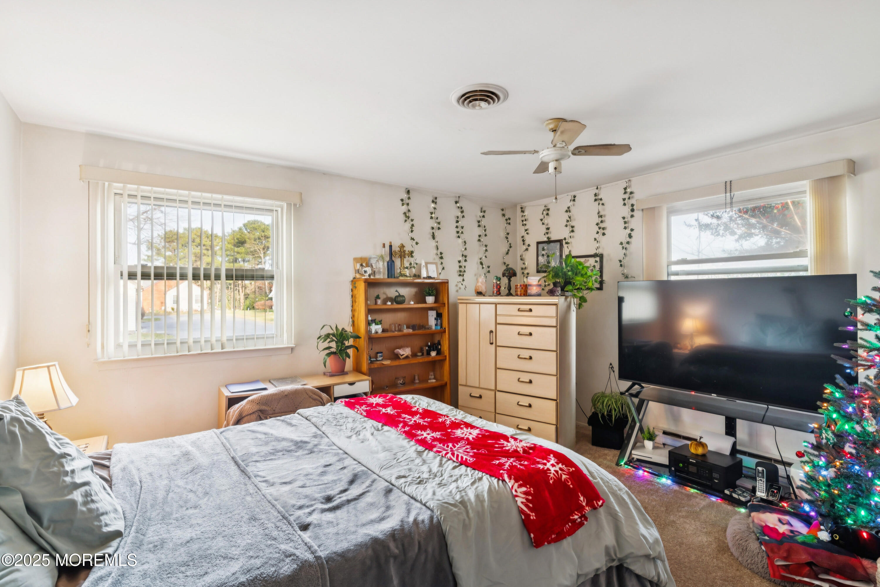 10A Alpine Road, Unit 63 Manchester Township, NJ 08759 - Photo 13 of 25 a bedroom with a bed and a flat screen tv