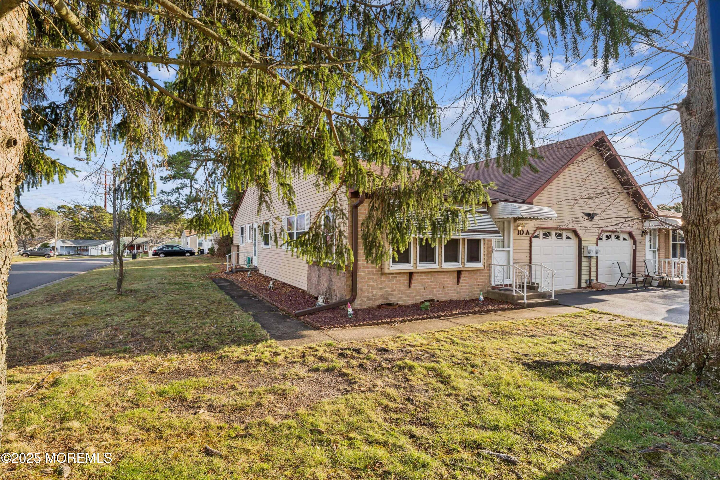 10A Alpine Road, Unit 63 Manchester Township, NJ 08759 - Photo 24 of 25 a view of a house with a yard