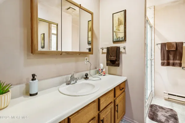 a bathroom with a sink and a mirror