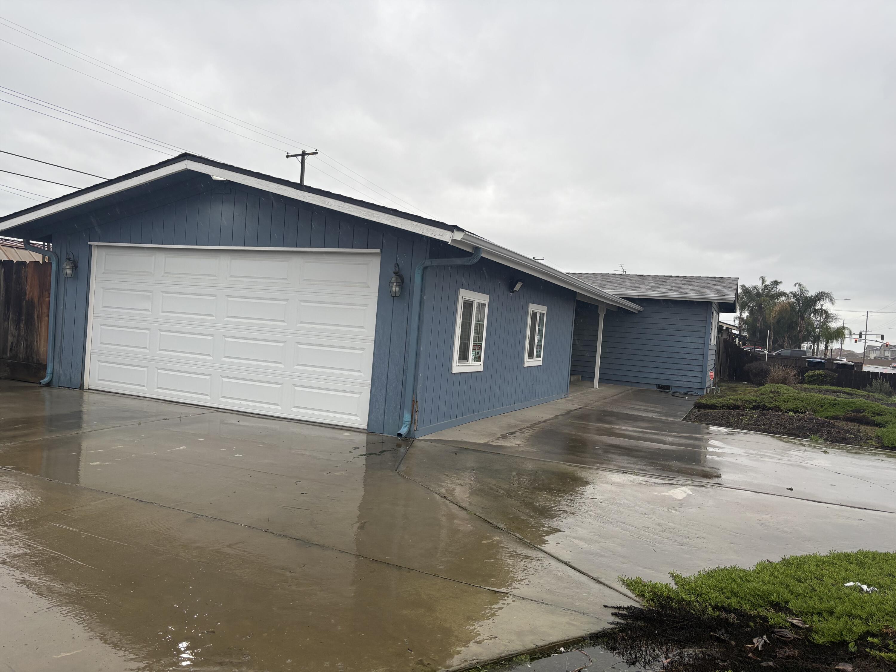 1109 West Riggin Avenue Visalia, CA 93291 - Photo 13 of 15 Outside of Garage