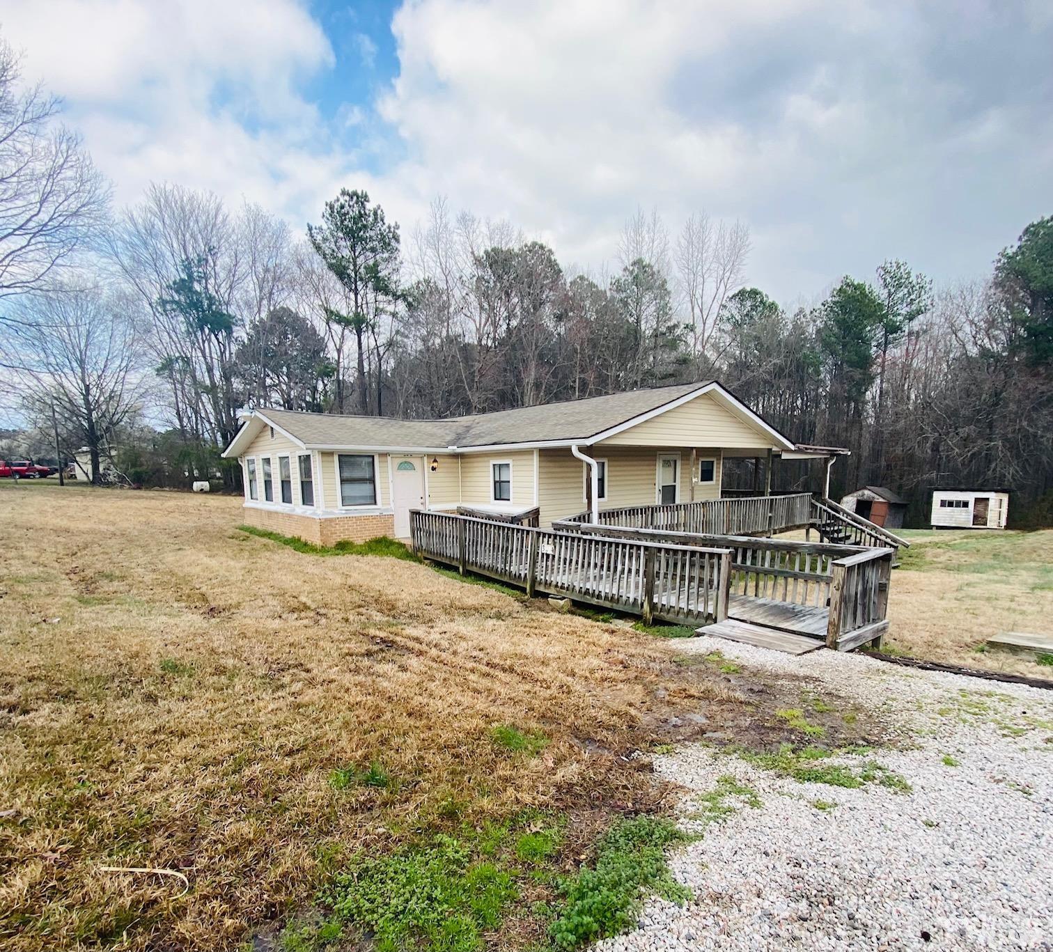 3274 Walters Road Creedmoor, NC 27522 - Photo 1 of 14 a front view of a house with garden