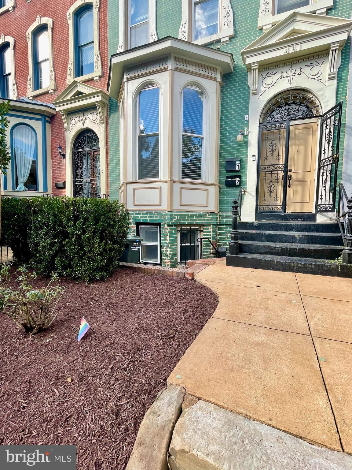 Unit entrance is to the left of main stairs