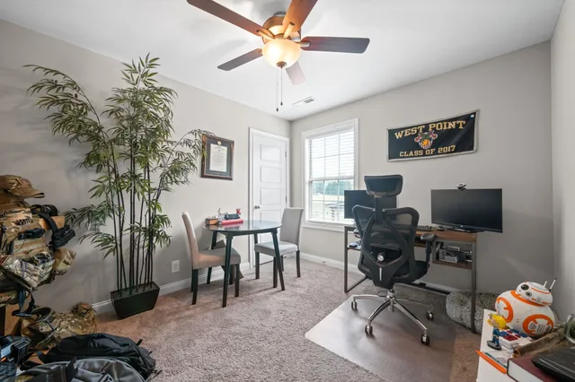 a view of a workspace with furniture and a livingroom