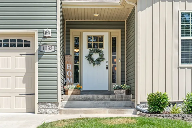 a front view of a house with a yard