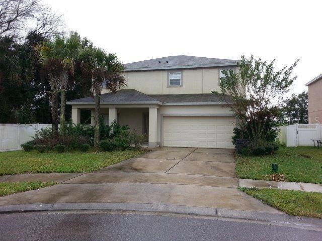 145 Bella Rosa Circle Sanford, FL 32771 - Photo 1 of 1 a front view of a house with garden