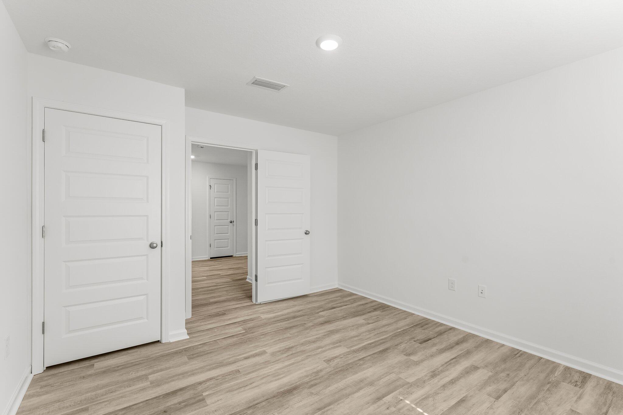 453 Riverwalk Circle Freeport, FL 32439 - Photo 13 of 35 wooden floor in an empty room