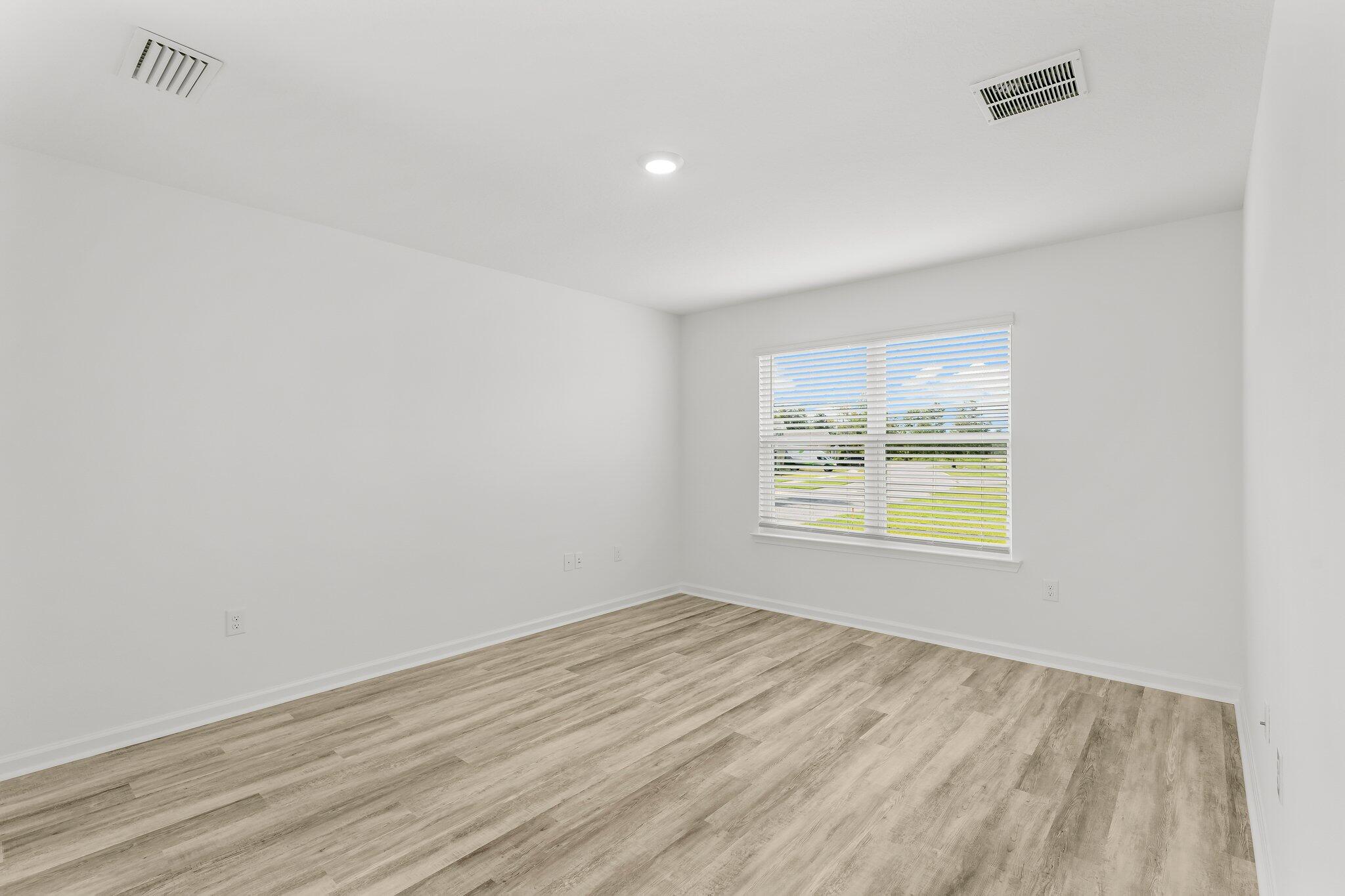 453 Riverwalk Circle Freeport, FL 32439 - Photo 22 of 35 an empty room with a window