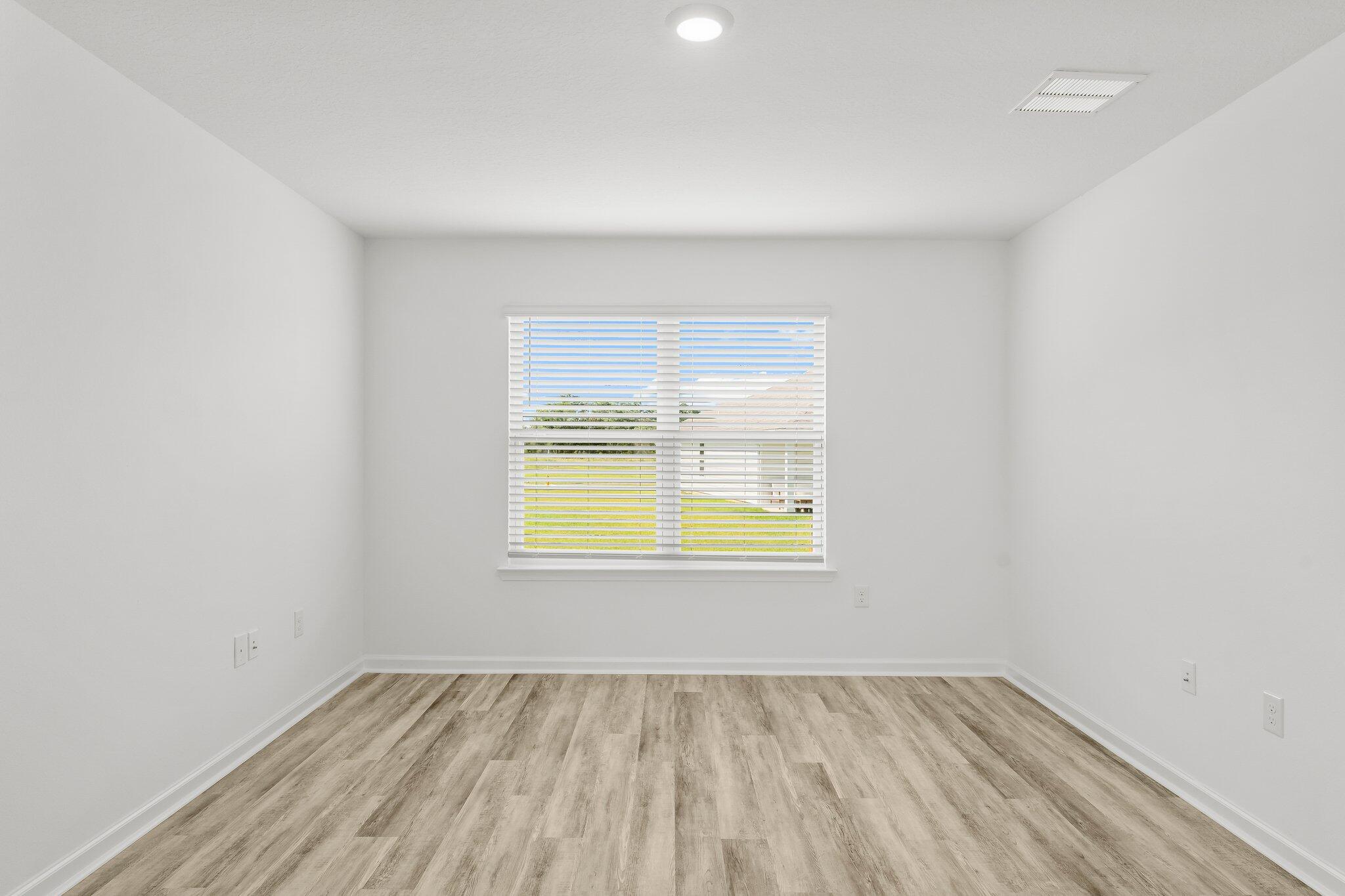 453 Riverwalk Circle Freeport, FL 32439 - Photo 23 of 35 an empty room with a window