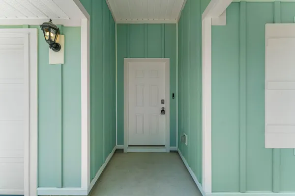 a view of a small space with wooden floor and closet
