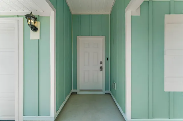 a view of a small space with wooden floor and closet