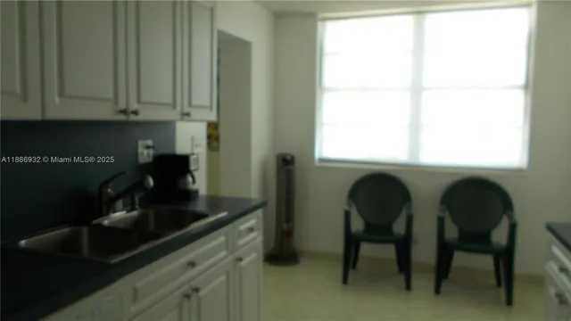 a kitchen with a table and chair