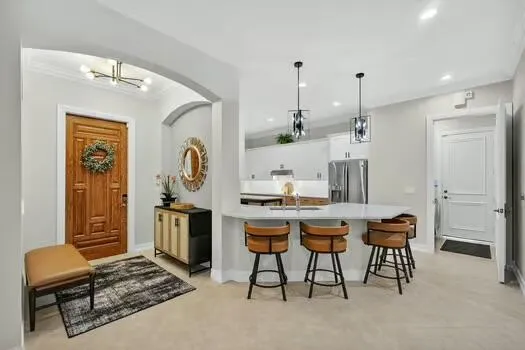 a room with furniture a rug and white walls