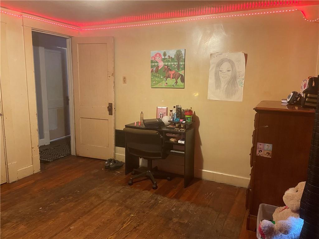 705 East Lutton Street New Castle, PA 16101 - Photo 14 of 23 a view of a workspace with furniture and wooden floor