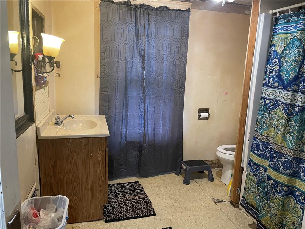 705 East Lutton Street New Castle, PA 16101 - Photo 20 of 23 a bathroom with a sink and a mirror