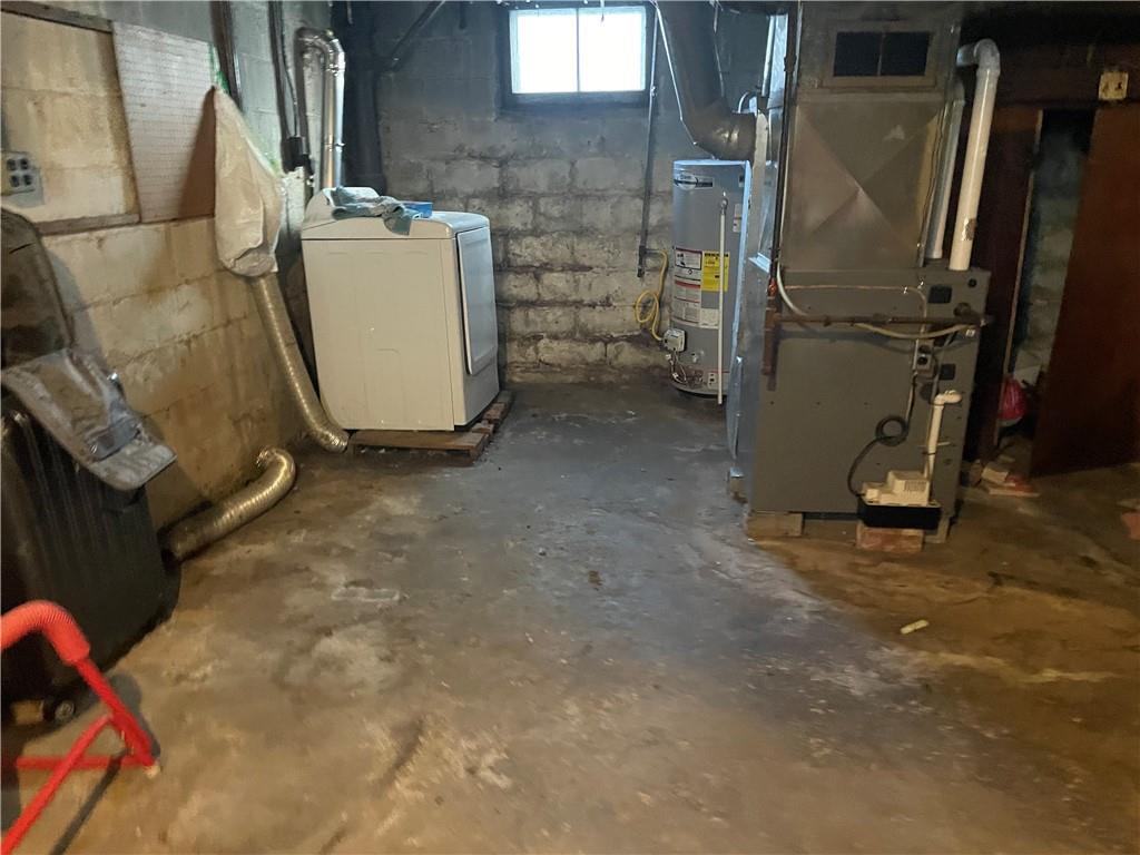 705 East Lutton Street New Castle, PA 16101 - Photo 23 of 23 a room with water heater and a refrigerator