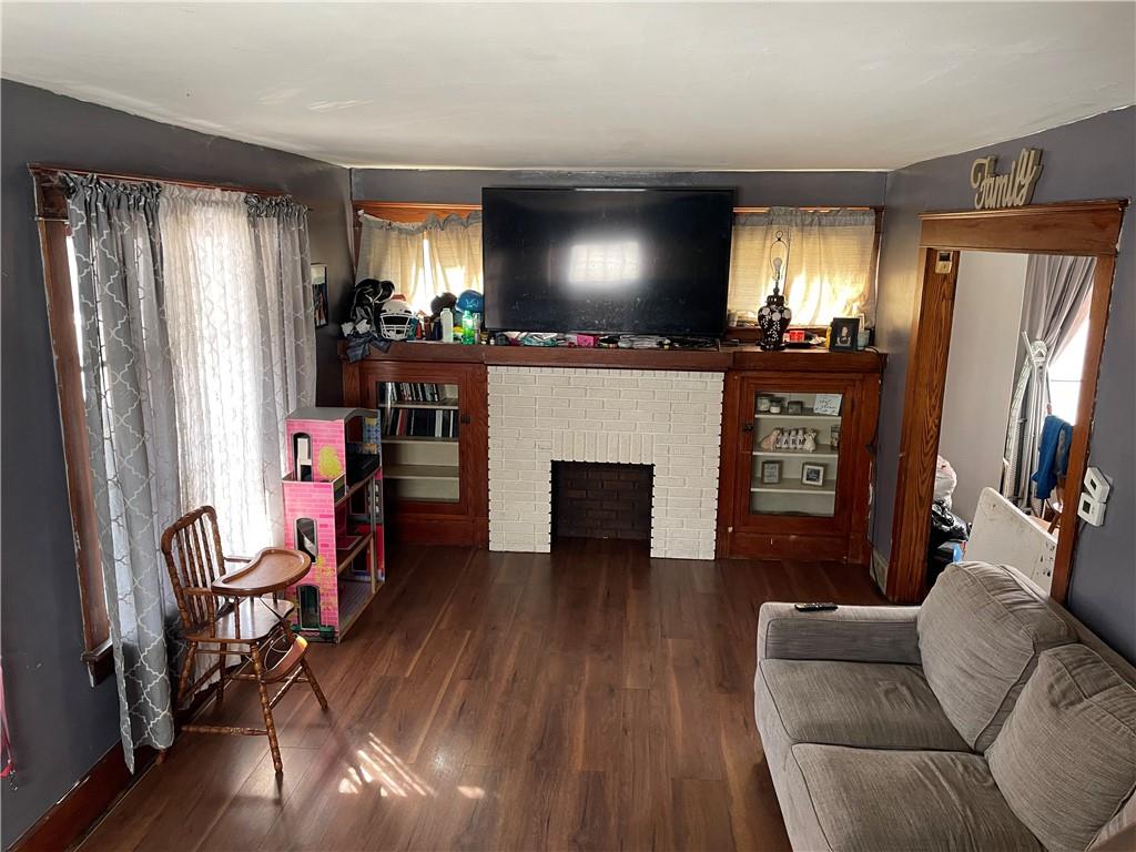 705 East Lutton Street New Castle, PA 16101 - Photo 8 of 23 a living room with furniture and a flat screen tv