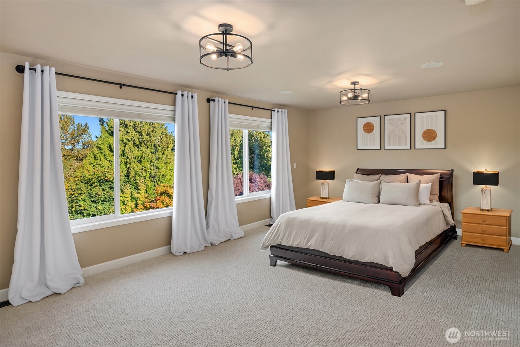 3129 115th Avenue Southeast Snohomish, WA 98290 - Photo 18 of 40 a spacious bedroom with a bed and a chandelier