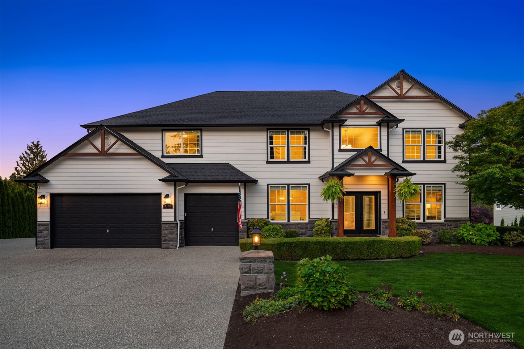 3129 115th Avenue Southeast Snohomish, WA 98290 - Photo 2 of 40 a front view of a house with a yard and garage