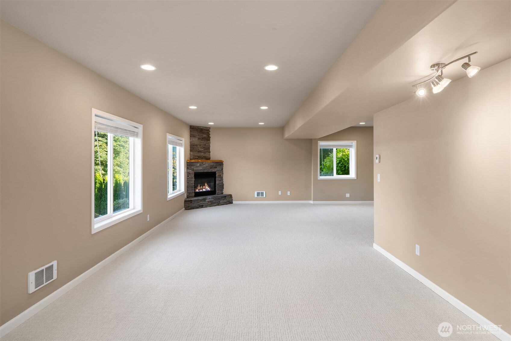 3129 115th Avenue Southeast Snohomish, WA 98290 - Photo 28 of 40 an empty room with windows and fireplace