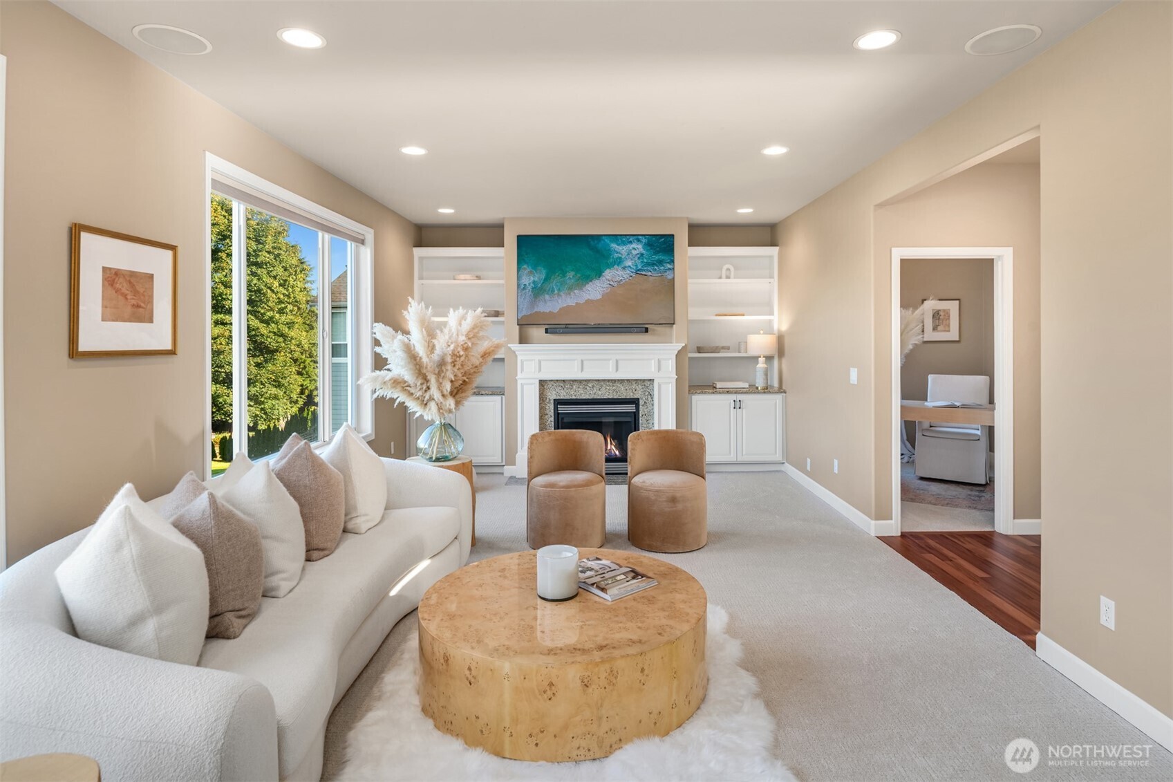 3129 115th Avenue Southeast Snohomish, WA 98290 - Photo 9 of 40 a living room with furniture a large window and a fireplace