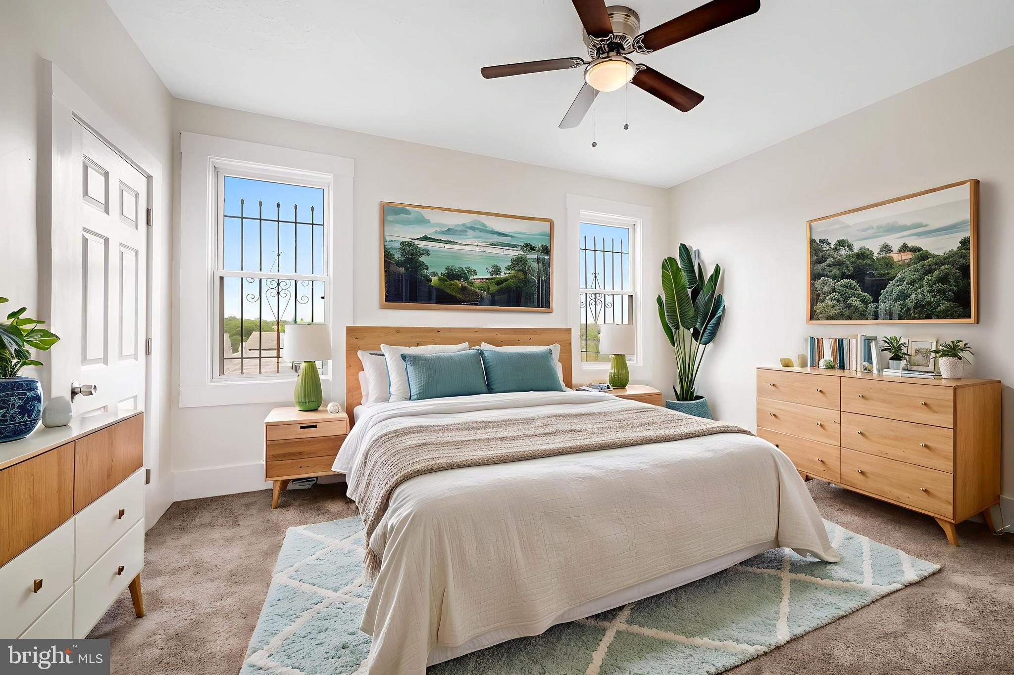 3003 Kentucky Avenue Baltimore, MD 21213 - Photo 16 of 32 a bedroom with a large bed and a window