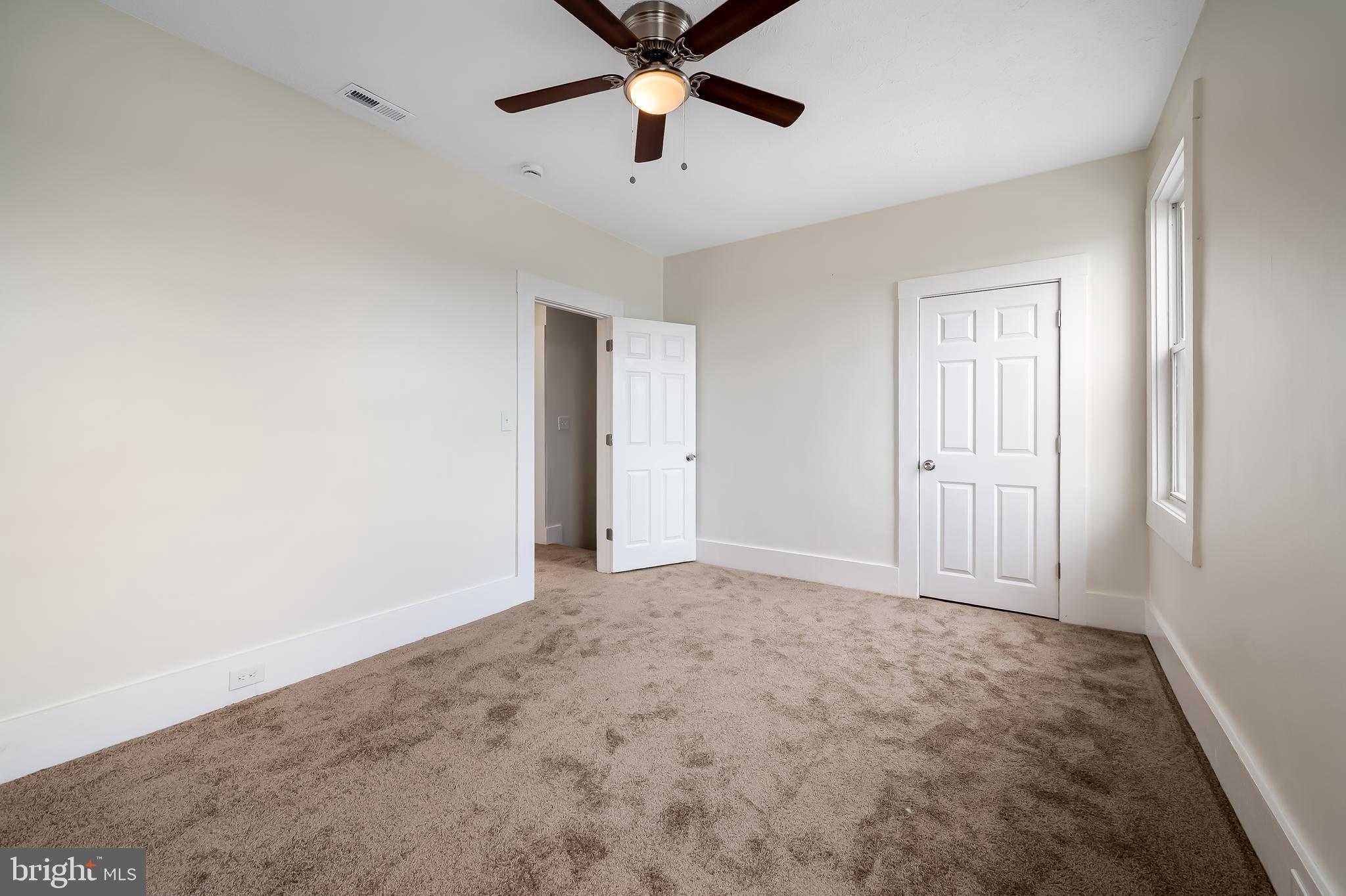 3003 Kentucky Avenue Baltimore, MD 21213 - Photo 17 of 32 an empty room with closet and windows