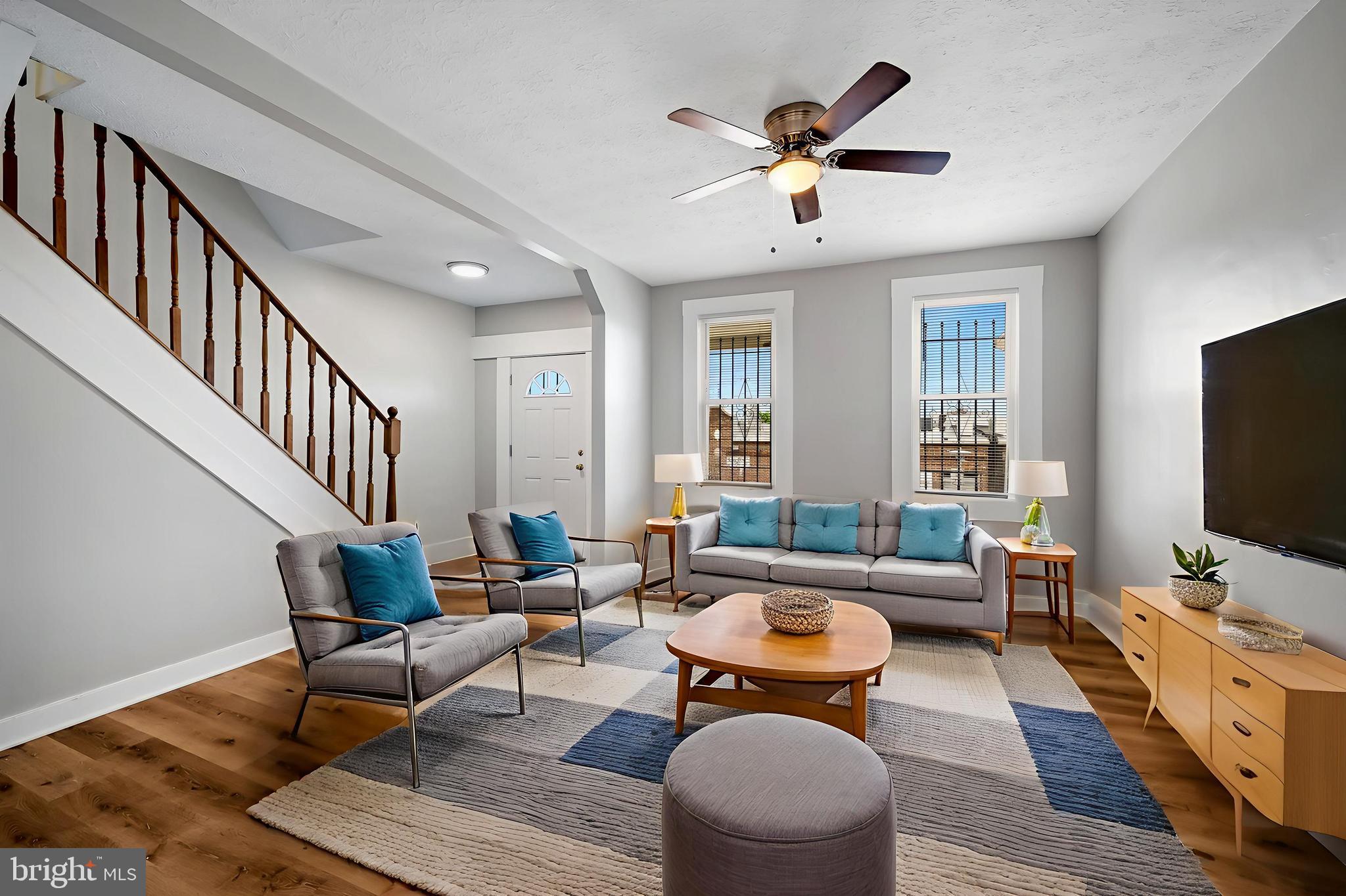 3003 Kentucky Avenue Baltimore, MD 21213 - Photo 4 of 32 a living room with furniture and a flat screen tv