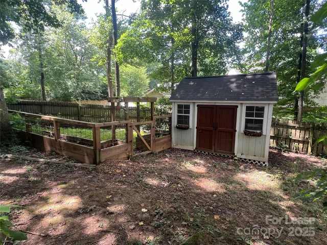 a view of a house with a yard and sitting area