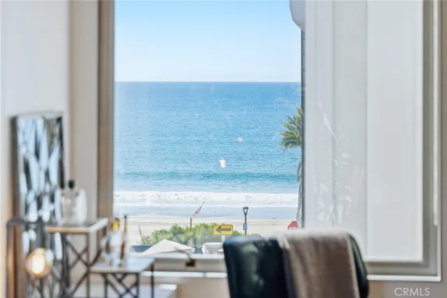 a backyard of a house with chairs and a fire pit
