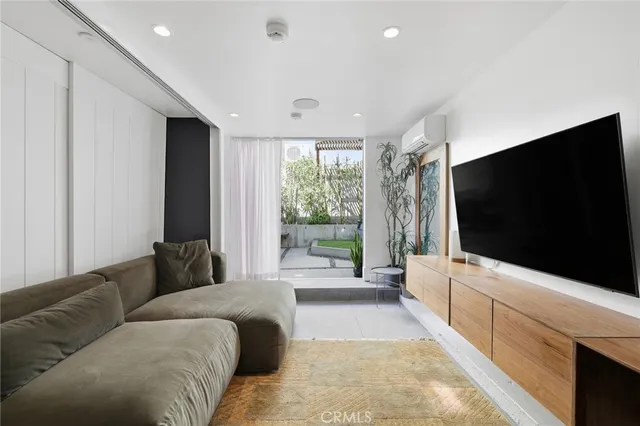 a building outdoor space with patio furniture and potted plants