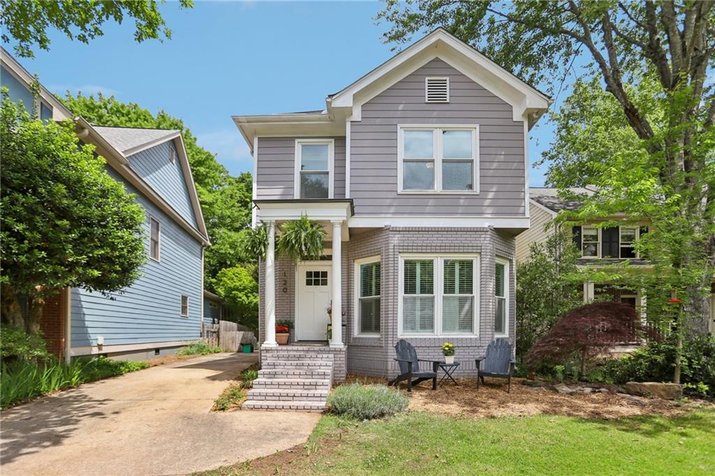 120 Candler Oaks Lane Decatur, GA 30030 - Photo 1 of 1 a view of a brick house with a yard plants and large tree