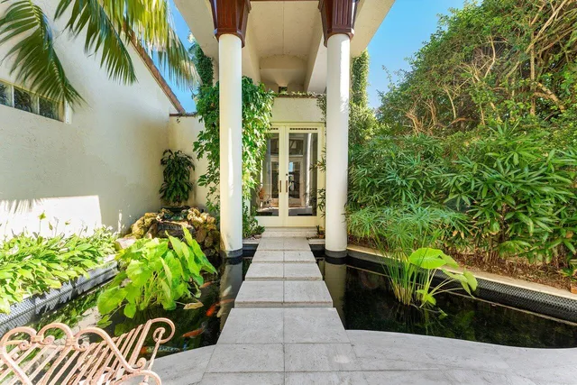a view of a dining room with furniture wooden floor and chandelier