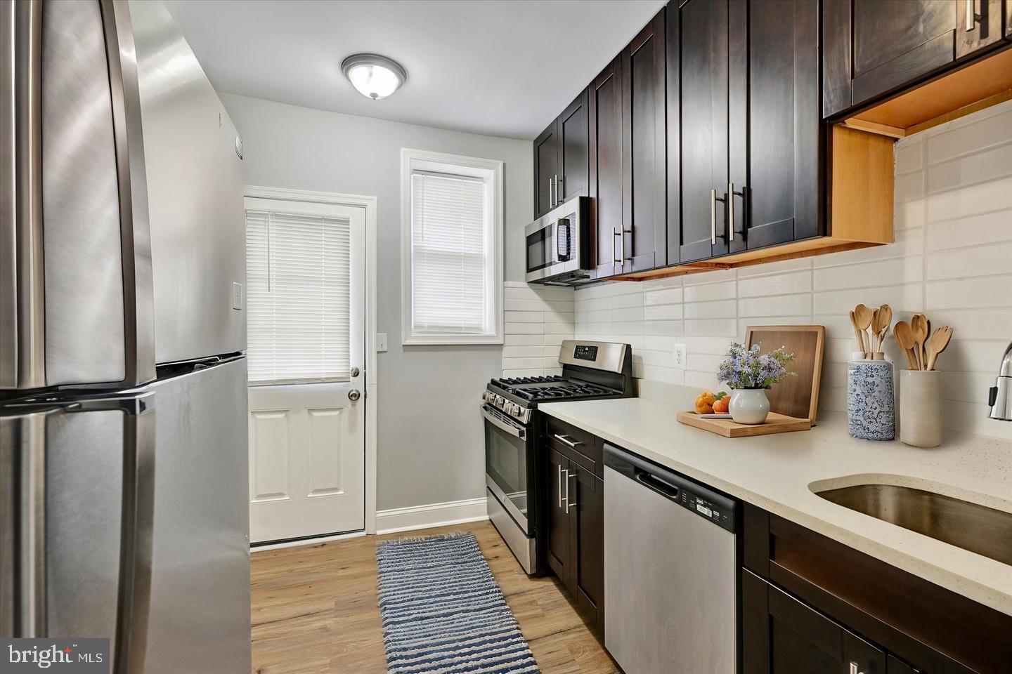 2706 East Chase Street Baltimore, MD 21213 - Photo 5 of 16 Kitchen virtually staged