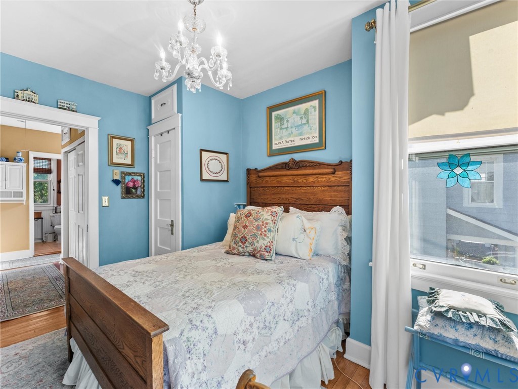 1812 Seddon Road Richmond, VA 23227 - Photo 35 of 56 Bedroom featuring hardwood flooring, a crystal cha