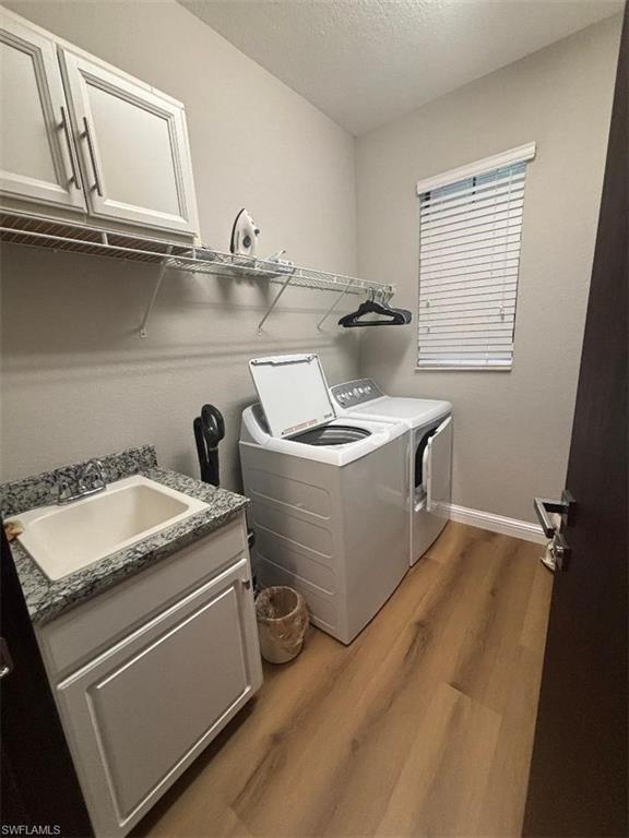 1599 Marton Court Naples, FL 34113 - Photo 18 of 22 a utility room with dryer and washer