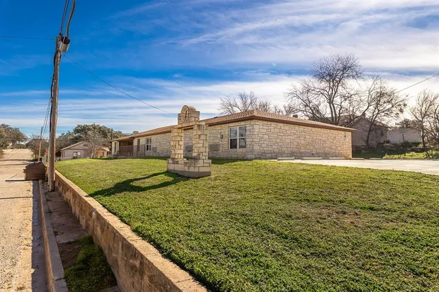 a view of a backyard of the house