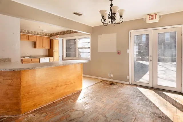 a view of a utility room with cabinet