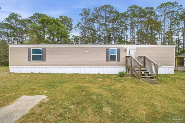 a view of front of house with a yard
