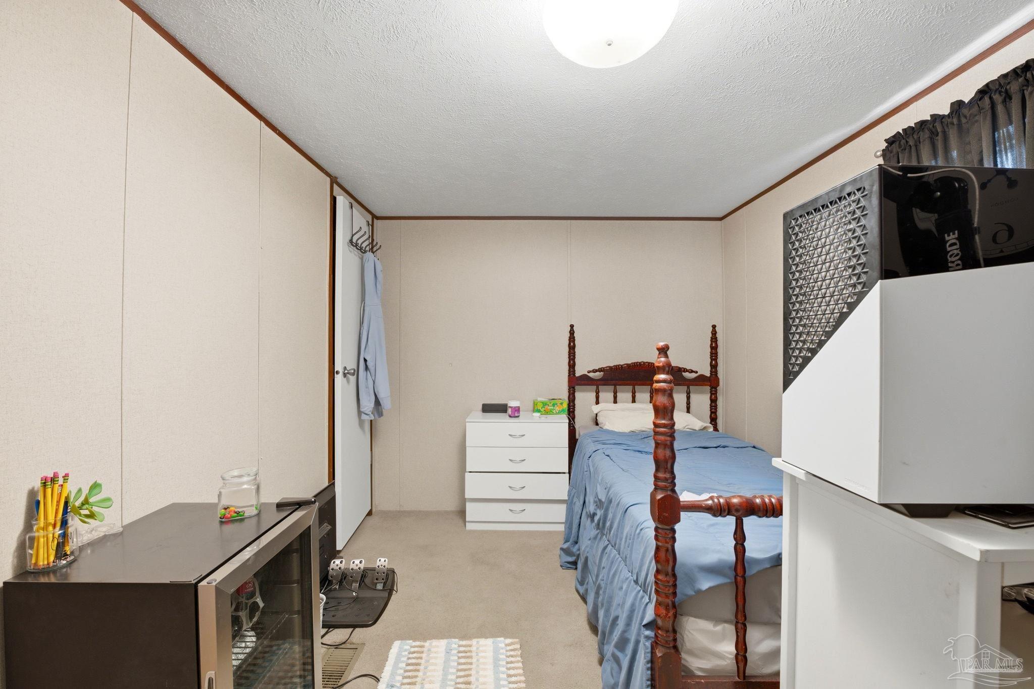 3338 Bob Tolbert Road Navarre, FL 32566 - Photo 18 of 29 a living room with furniture