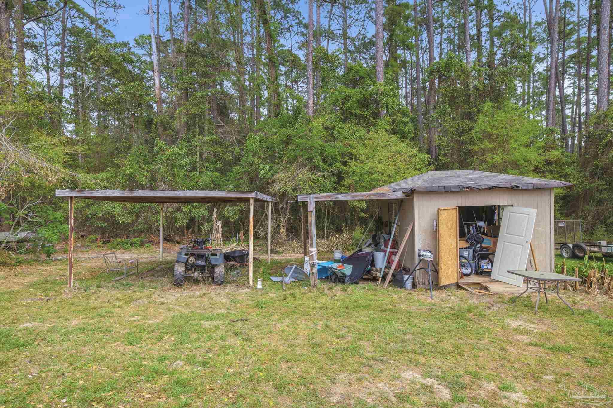 3338 Bob Tolbert Road Navarre, FL 32566 - Photo 24 of 29 a view of outdoor space with seating