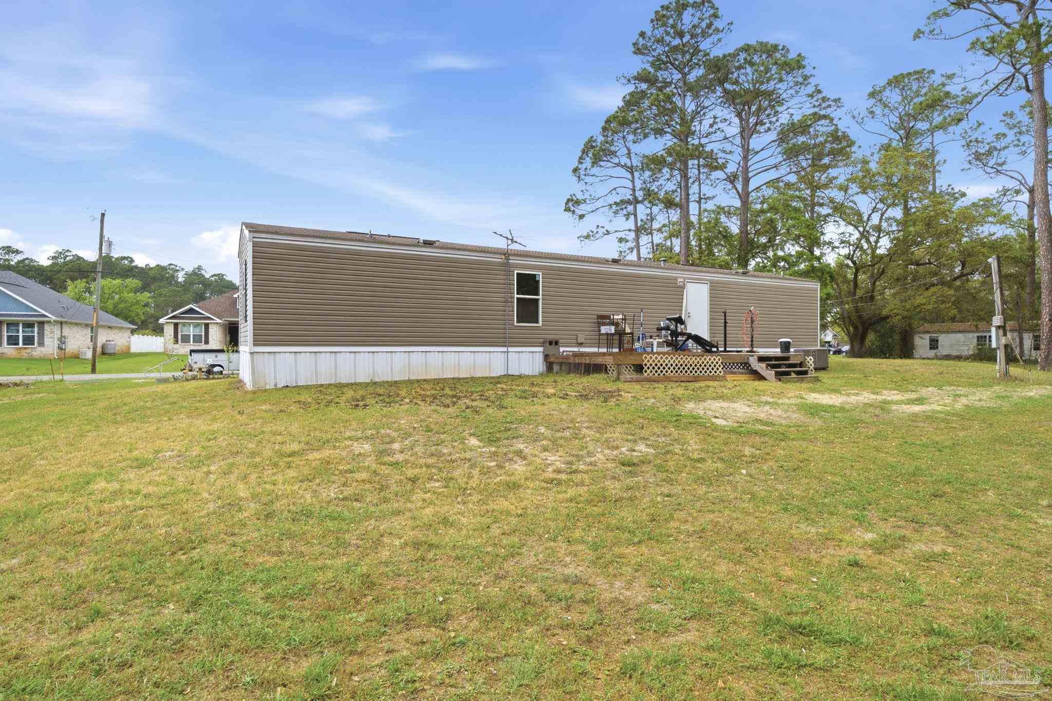 3338 Bob Tolbert Road Navarre, FL 32566 - Photo 26 of 29 a house view with a outdoor space