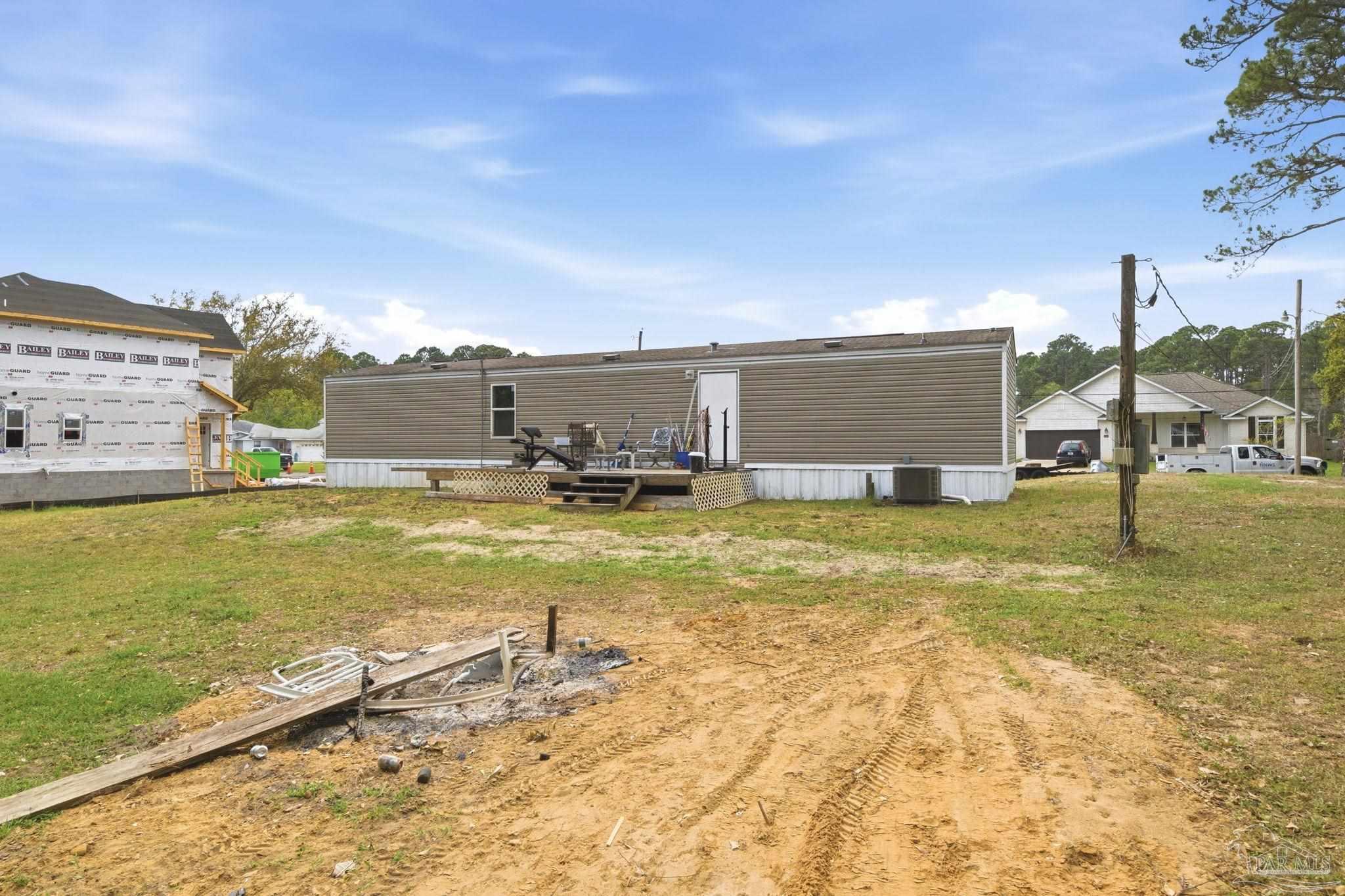 3338 Bob Tolbert Road Navarre, FL 32566 - Photo 27 of 29 a view of a swimming pool with an ocean view
