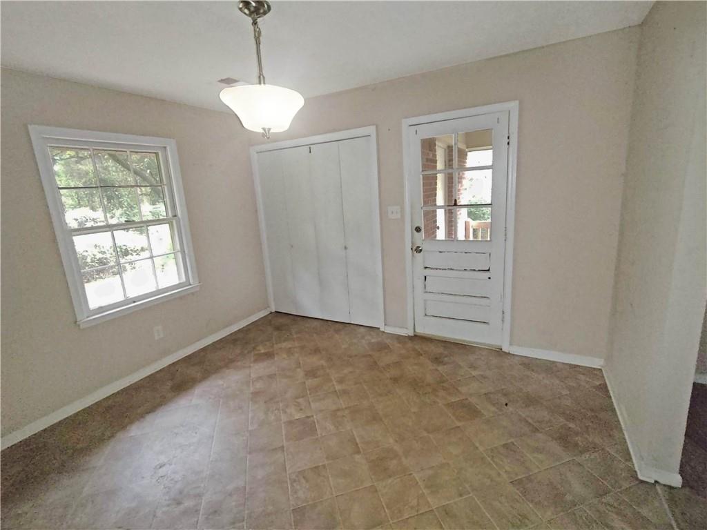 497 Highway 212 Covington, GA 30016 - Photo 6 of 14 a view of an empty room with a window