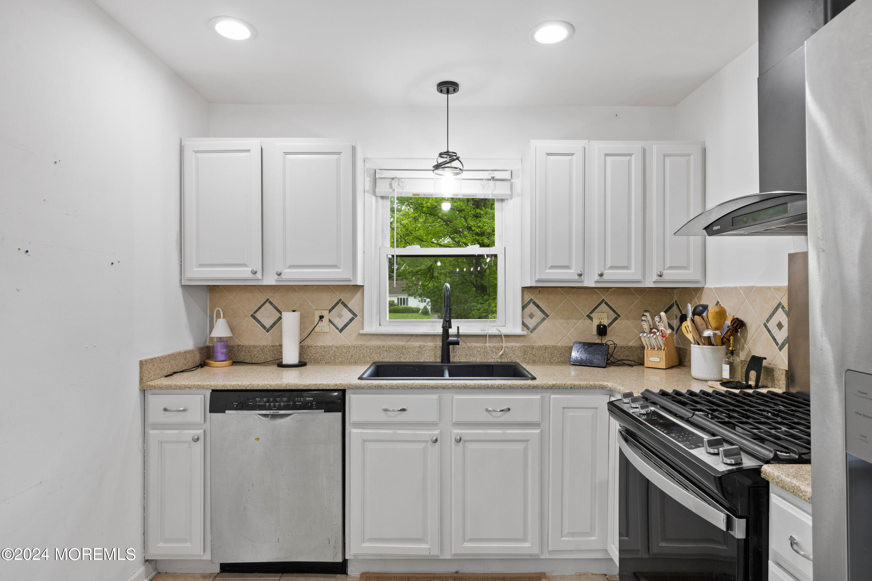 429 Cottrell Road Matawan, NJ 07747 - Photo 14 of 22 a kitchen with appliances cabinets and a window