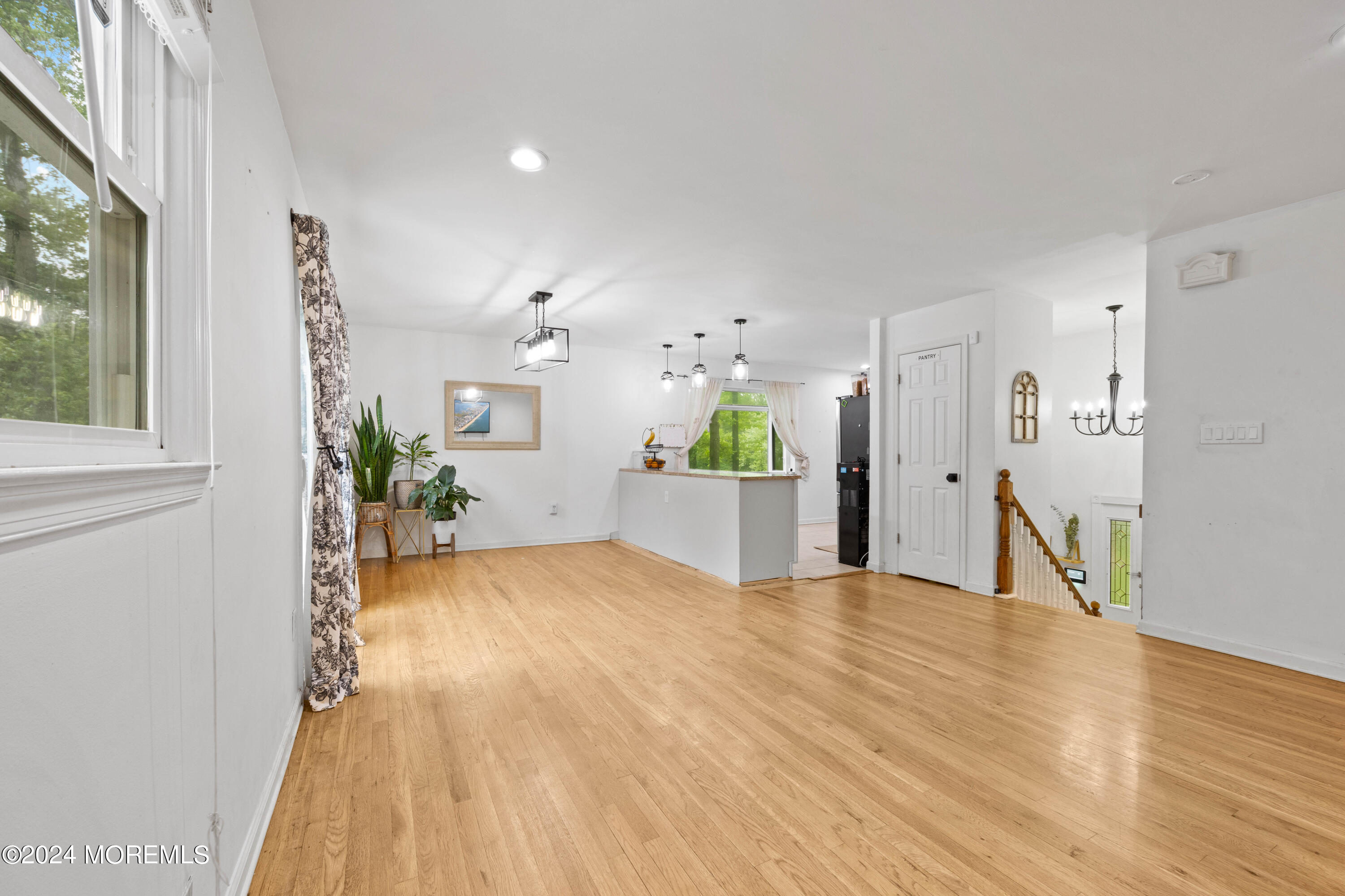 429 Cottrell Road Matawan, NJ 07747 - Photo 3 of 22 a view of a living room and kitchen with furniture