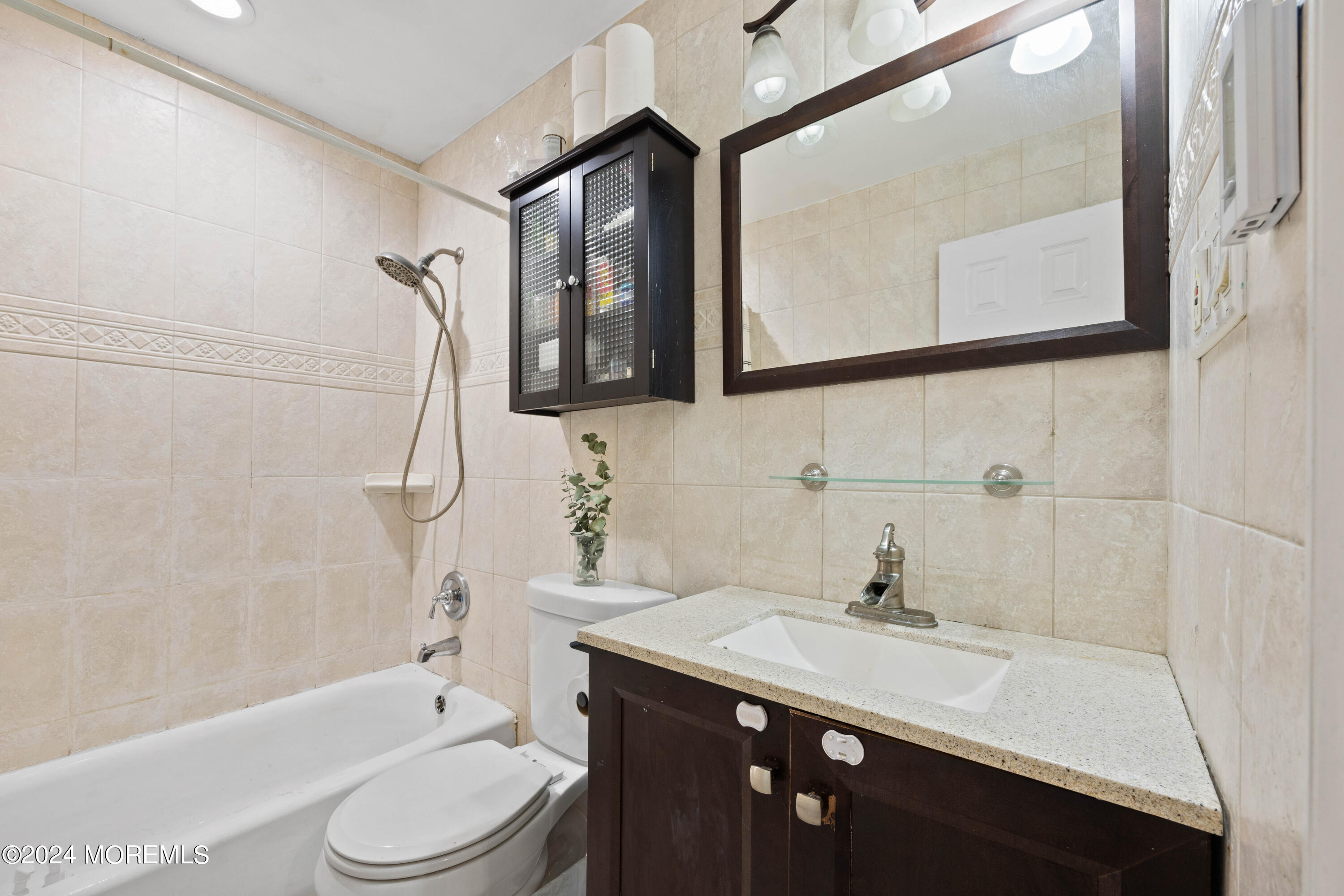 429 Cottrell Road Matawan, NJ 07747 - Photo 7 of 22 a bathroom with a sink a toilet and shower