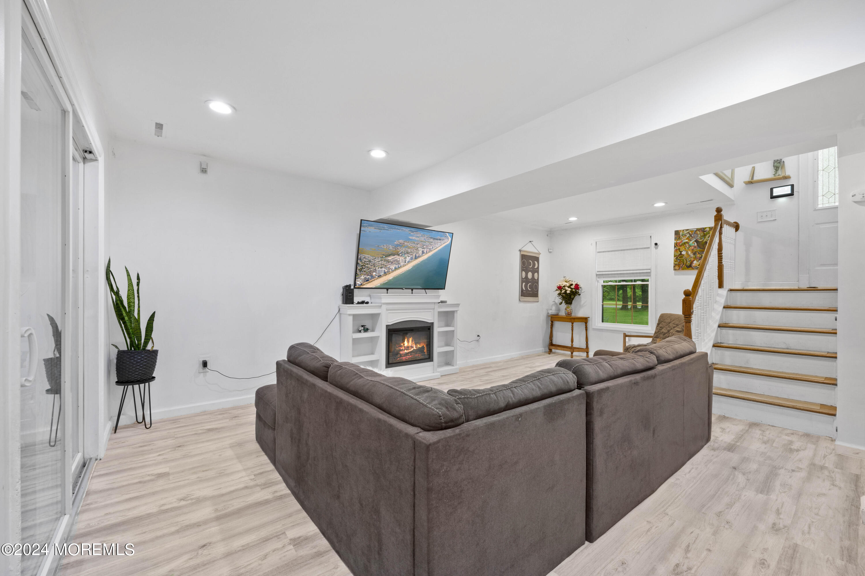 429 Cottrell Road Matawan, NJ 07747 - Photo 8 of 22 a living room with furniture and a wooden floor
